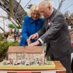 The King and Queen cutting a bespoke cake at the Eden Project in Cornwall, created by Niki Lowe Cake Design